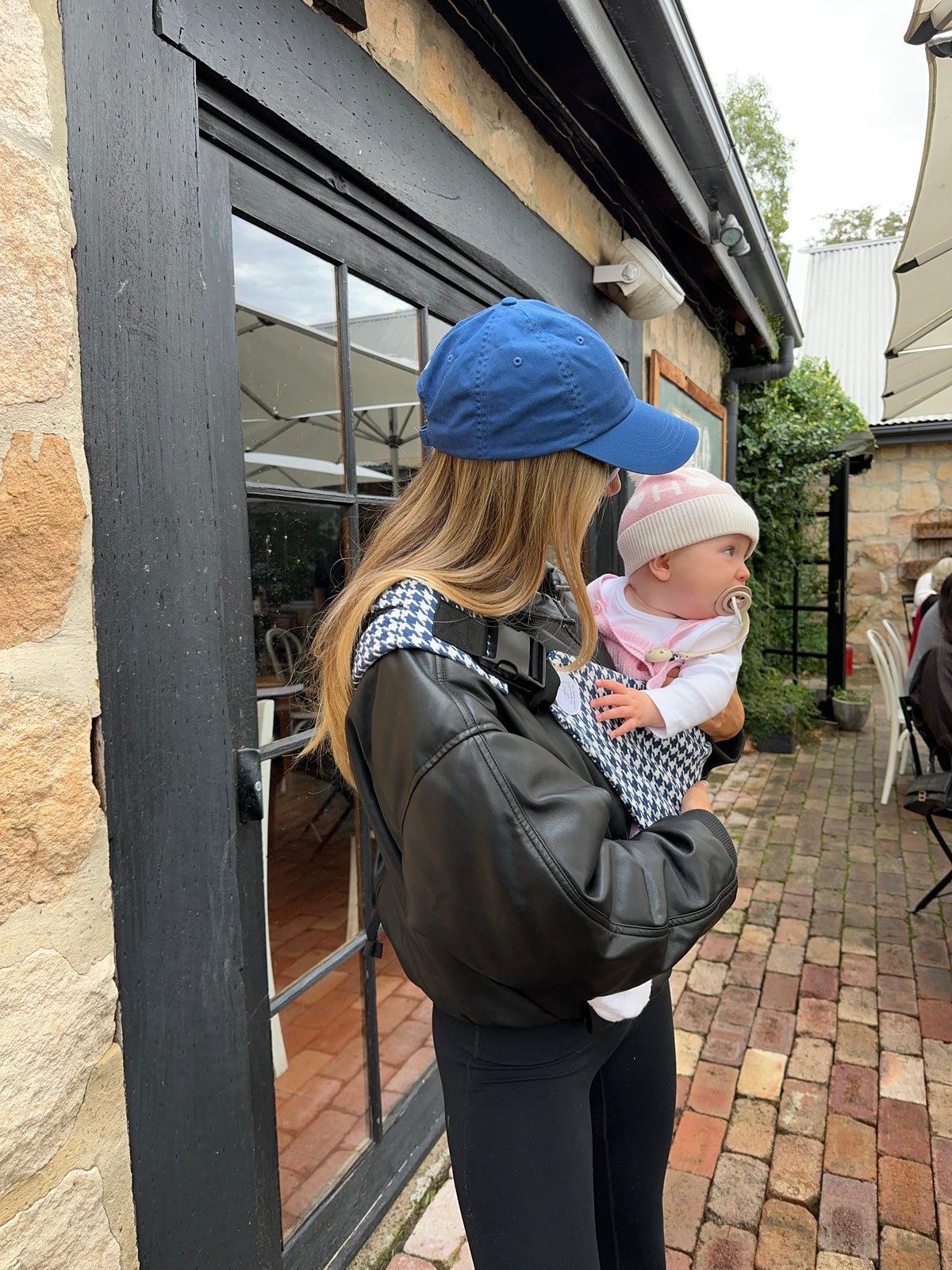 Harbour | mum holding baby in Ever carrier in cafe