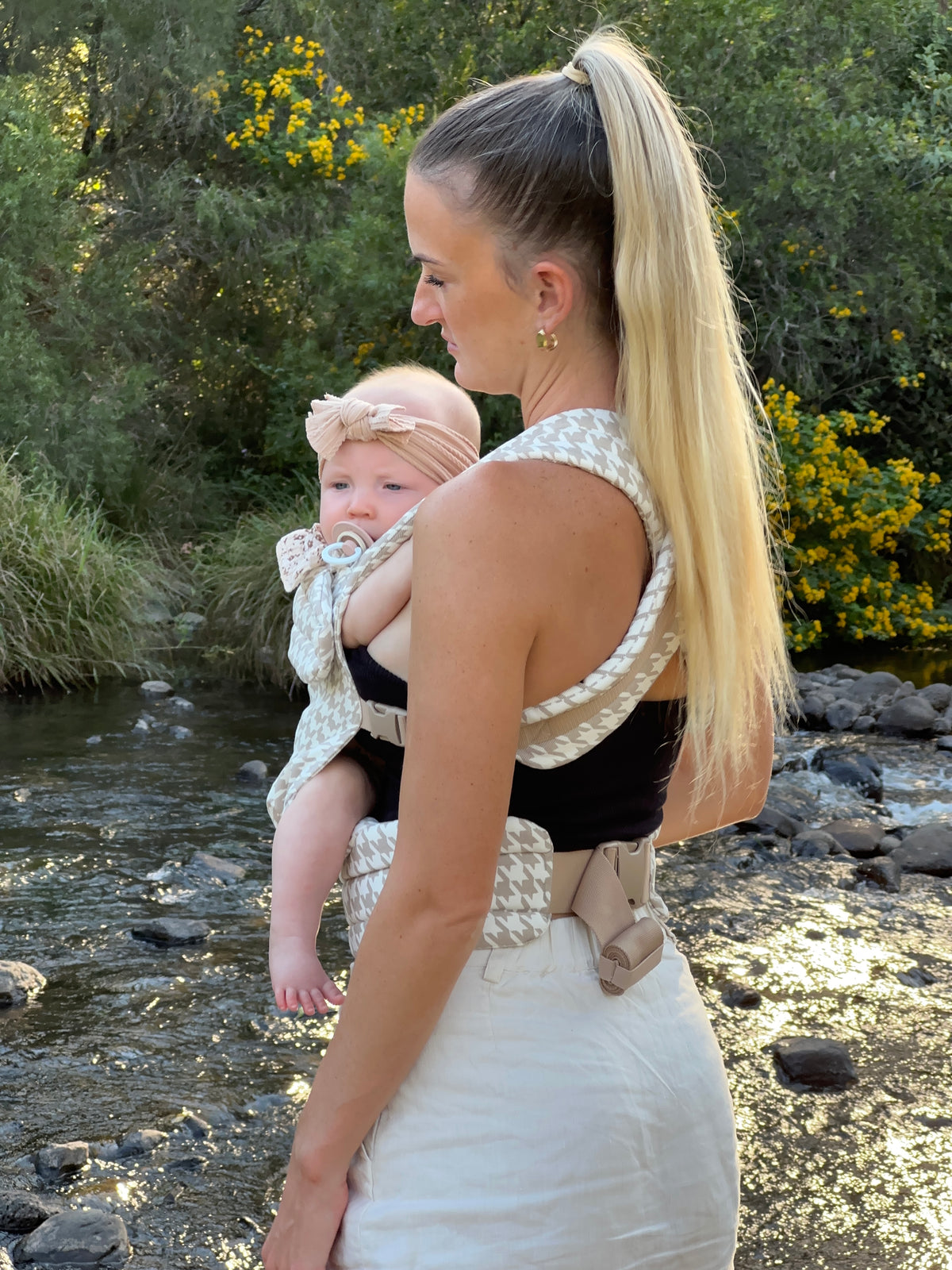 Oat | Mum carrying baby in Haven Carrier outside in nature with tree's and creek. Back view